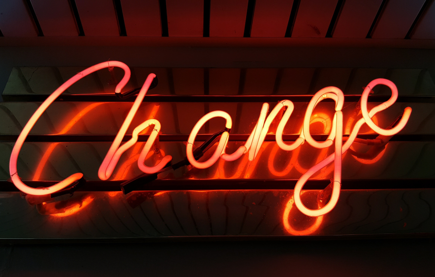 Light up sign that reads "change".