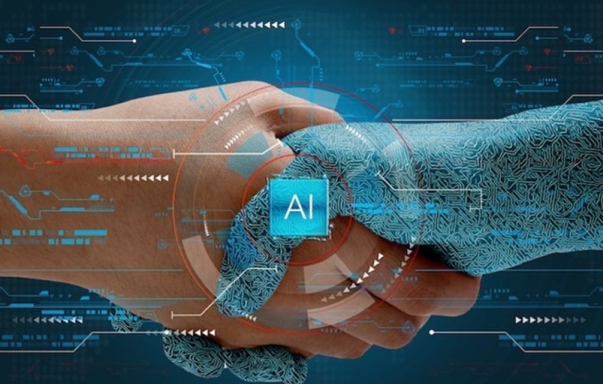 image of a human hand shaking a digital hand with the term "AI" in the middle