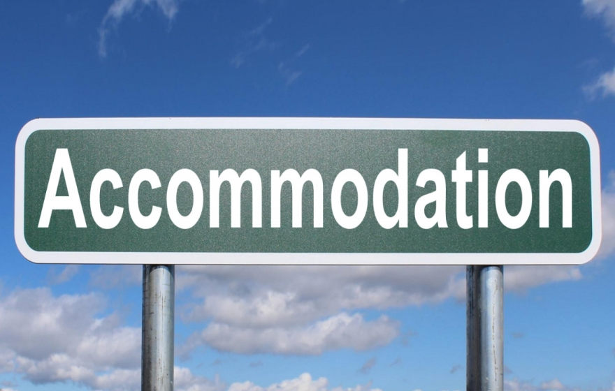 Road sign saying Accommodation.