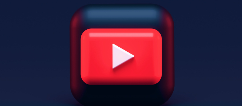 Red video symbol with white play button against dark blue background.