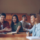 College students interacting together in class.