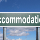 Road sign saying Accommodation.
